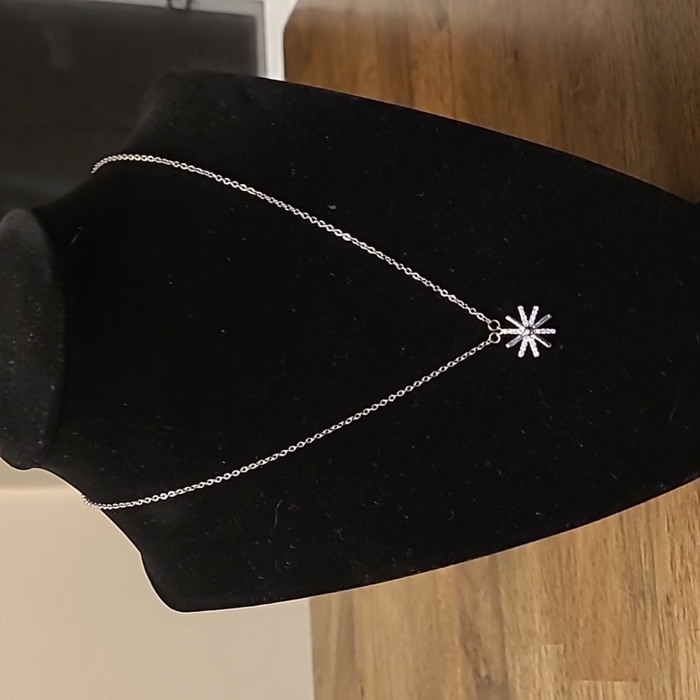 Short silver tone snowflake necklace